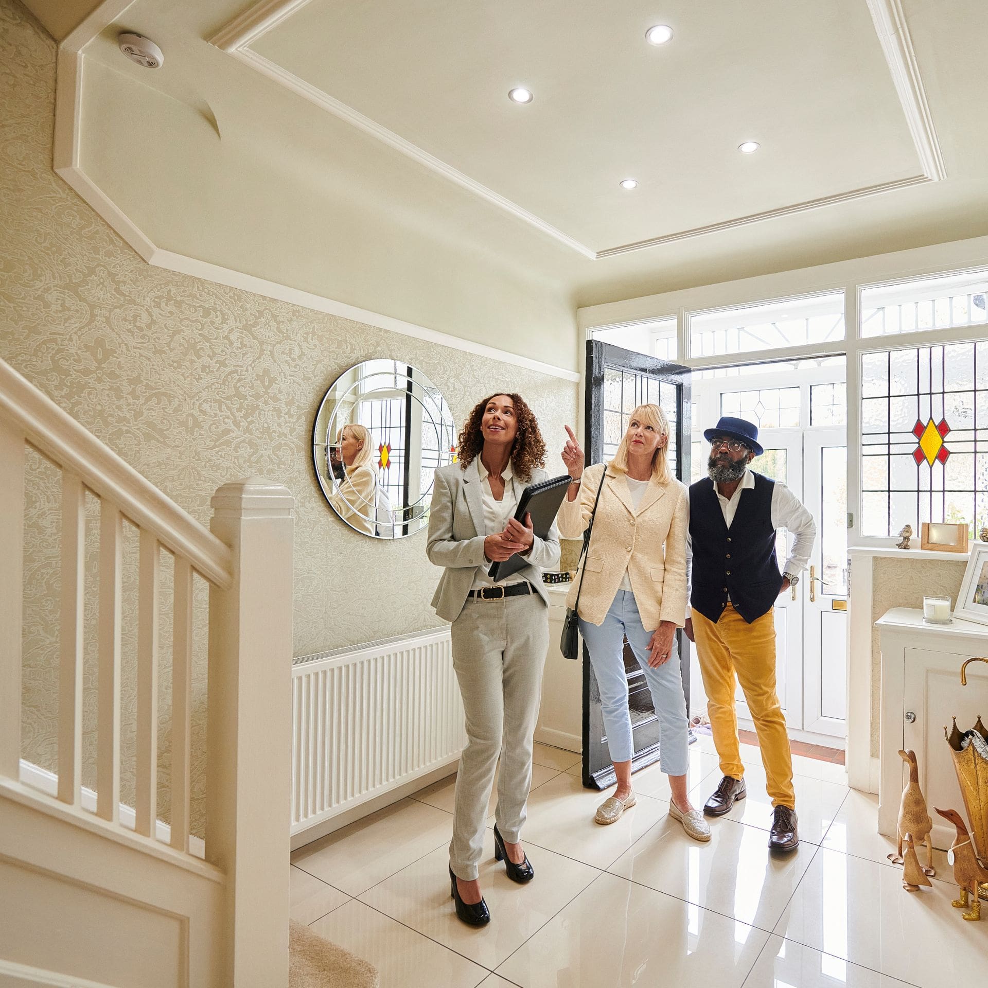 An estate agent showing a couple a house